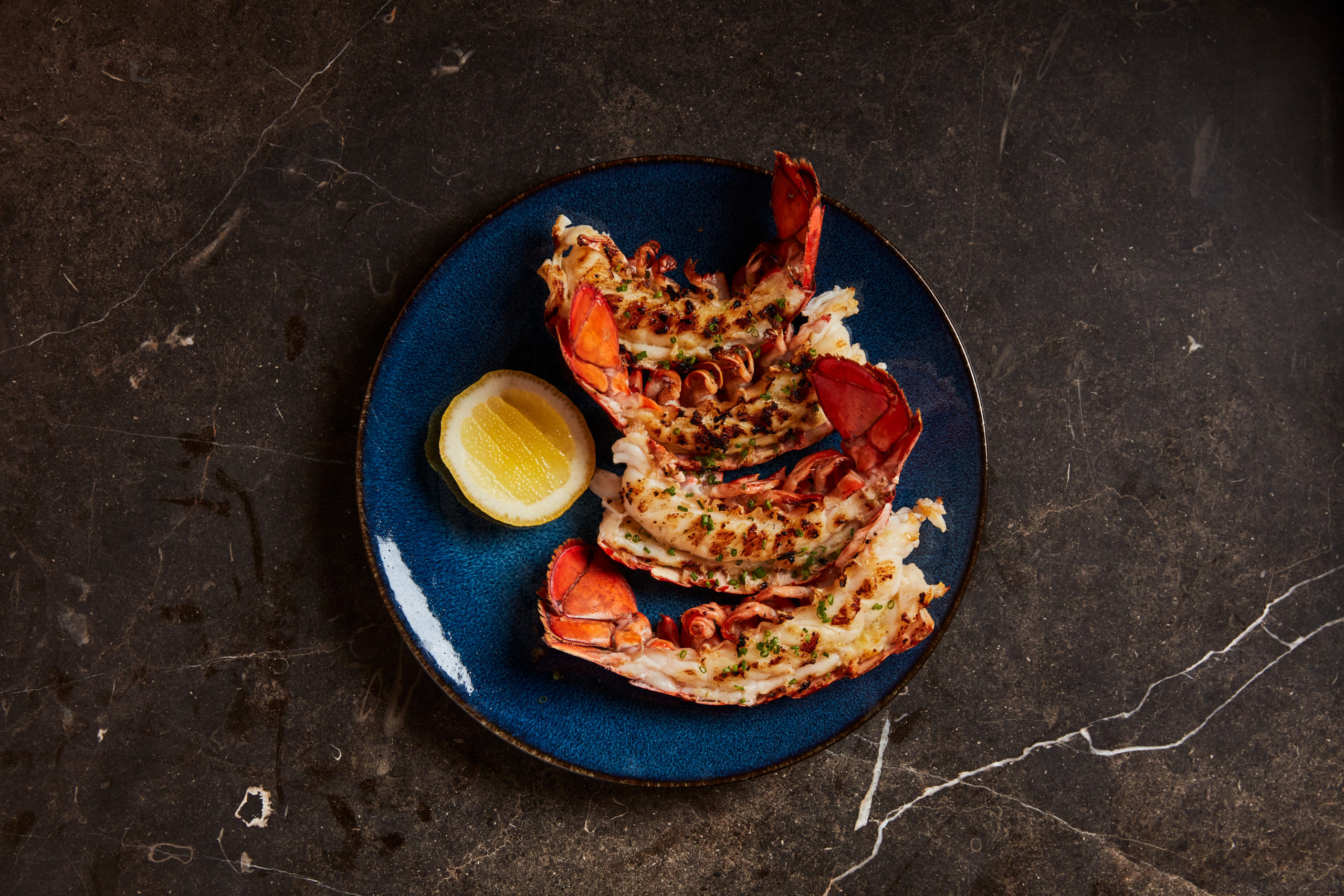 Lobster Tails cooked over the wood fire with yuzu-kosho garlic butter